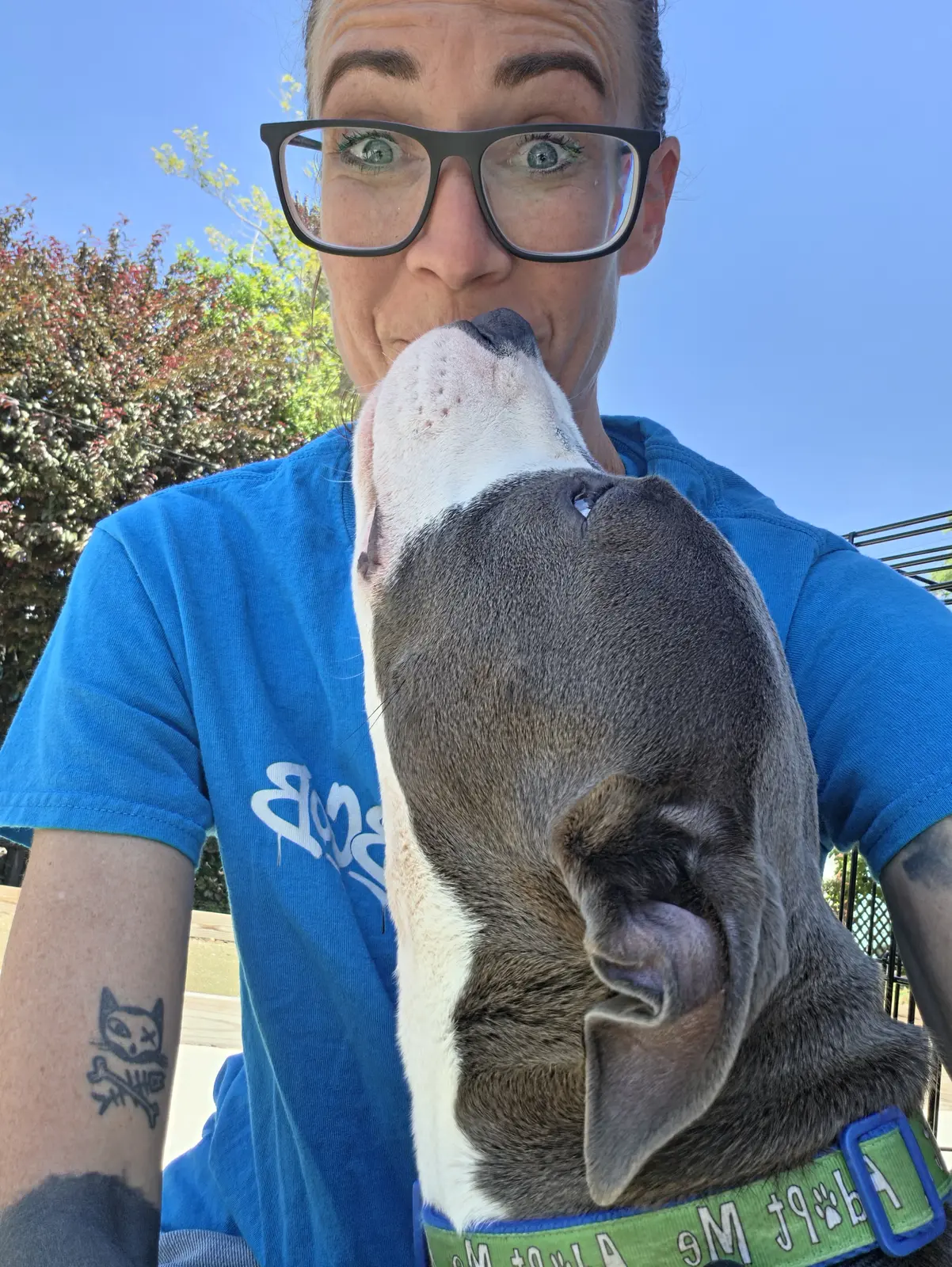 A Because of Bubbles rescuer sharing a joyful moment with a rescue dog