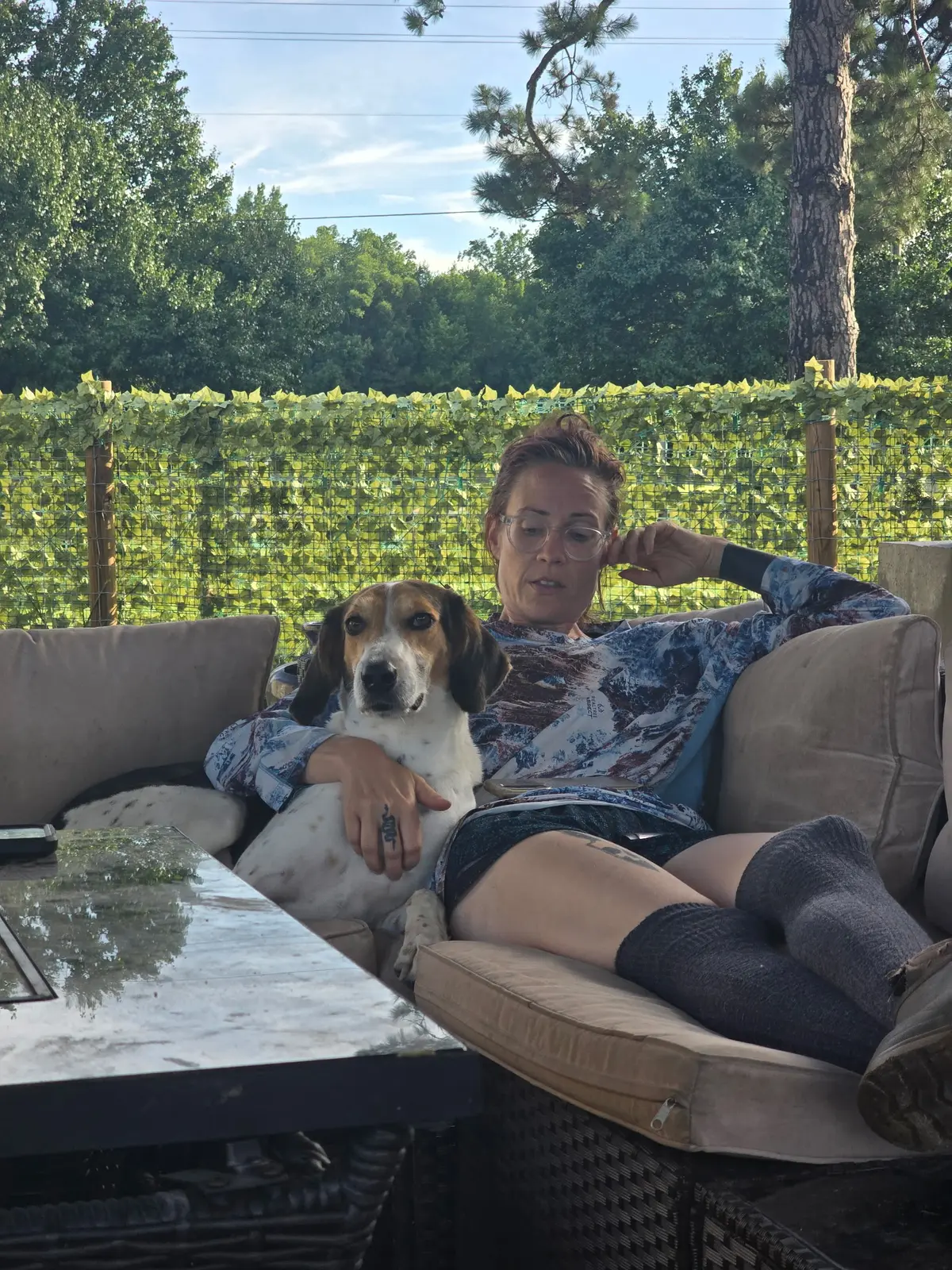 A rescue dog relaxing with a foster caregiver